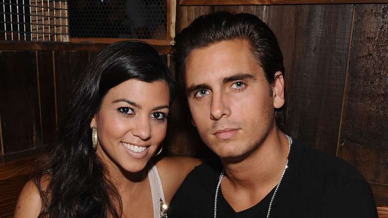 Scott Disick and Kourtney Kardashian posing together in July 2008