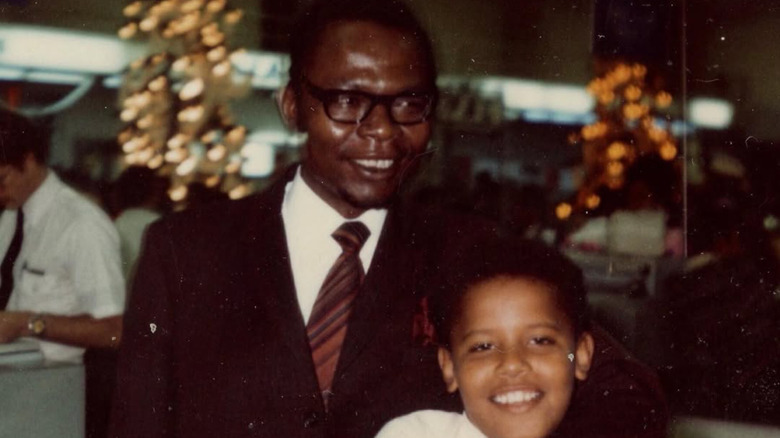 Barack Obama Sr. with his arm around a young Barack Obama Jr.