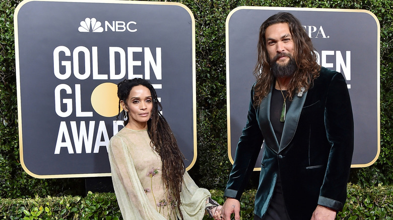 Lisa Bonet and Jason Momoa holding hands at the Golden Globe awards