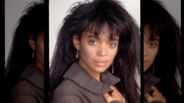 A studio headshot of Lisa Bonet posing in a sweater