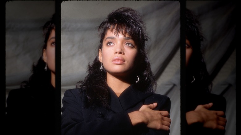 A headshot of Lisa Bonet wearing silver earrings