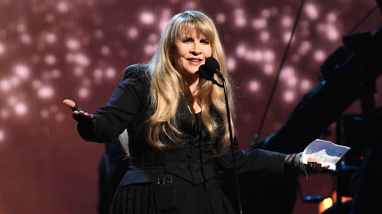 Stevie Nicks speaking into a mic