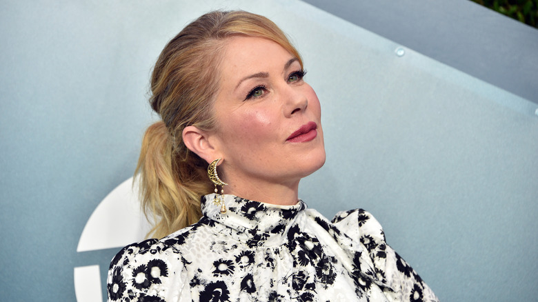 Christina Applegate posing in a white and black dress