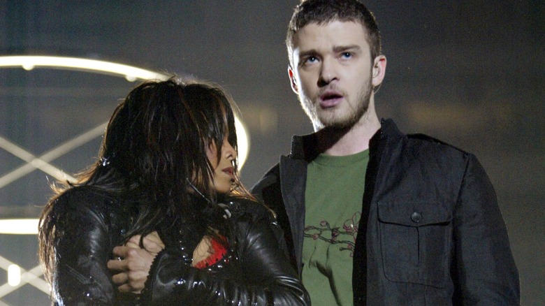 Janet Jackson covering her breast next to Justin Timberlake at the Super Bowl