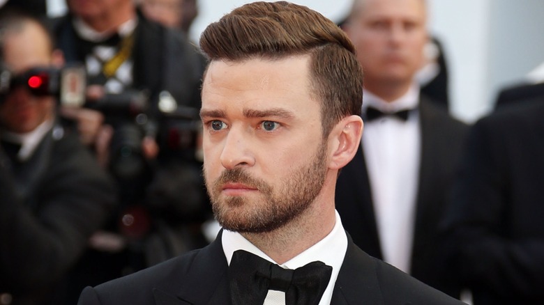 Justin Timberlake in a suit and bowtie looking intense