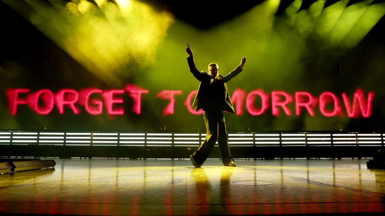 Justin Timberlake's silhouette in front of red text reading FORGET TOMORROW