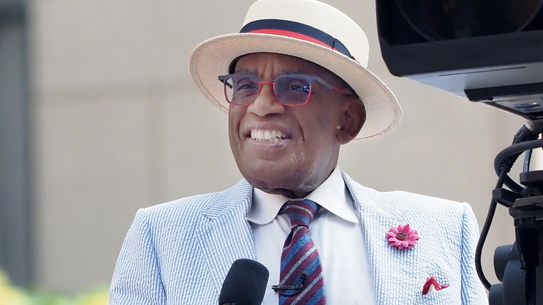 Al Roker giving speech in hat