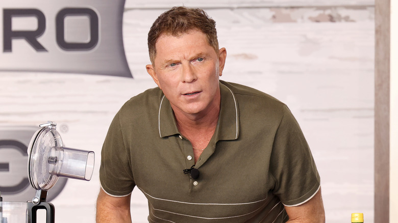 Bobby Flay leaning down