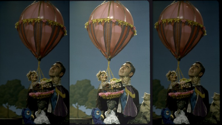 Fred Rogers with his puppets