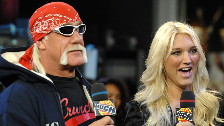 Brooke Hogan and Hulk Hogan holding MuchMusic mics during interview