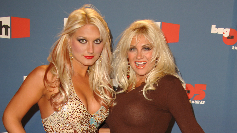 Brooke and Linda Hogan posing on step-and-repeat