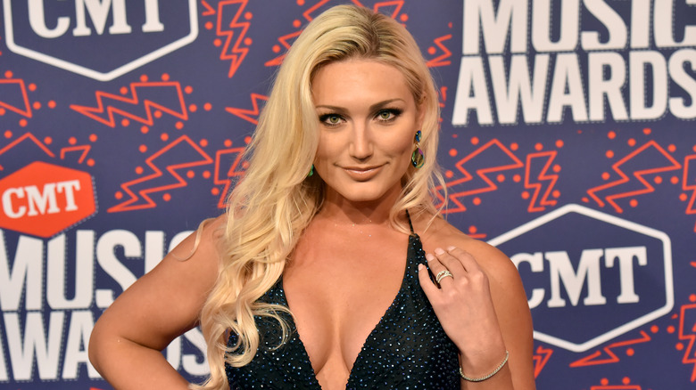Brooke Hogan in plunging black beaded dress at CMT awards