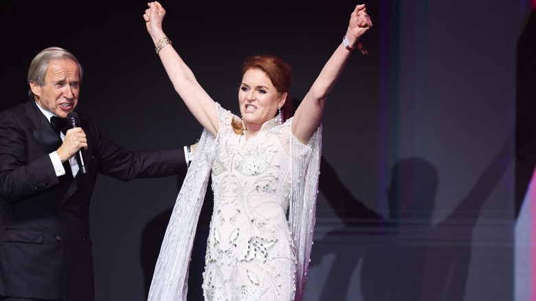 Sarah Ferguson with her arms in the air at Cannes 2024