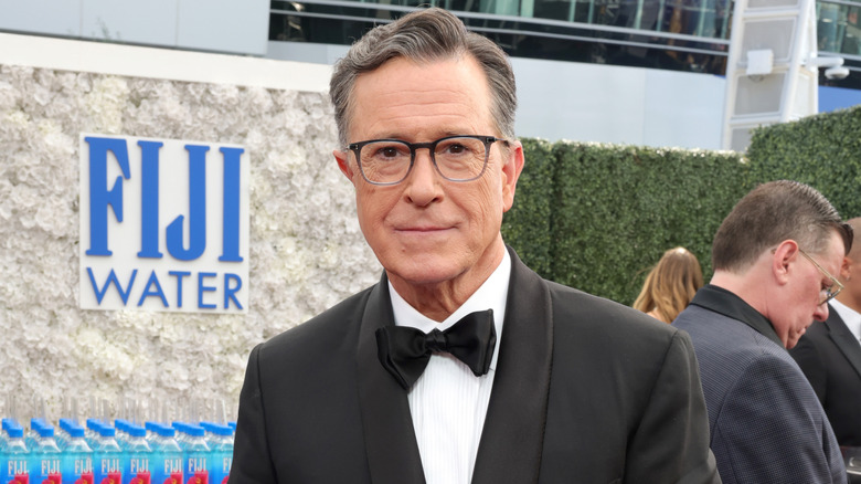 Closeup of Stephen Colbert looking down the camera at event