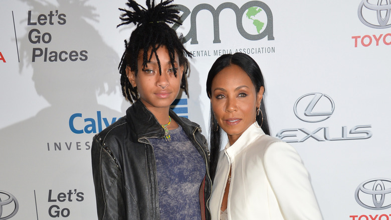 Willow Smith posing on the red carpet with Jada Pinkett Smith