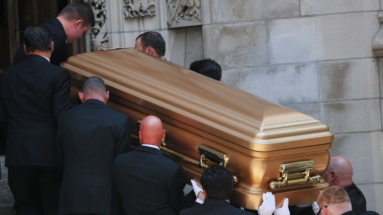 Pallbearers carrying Ivana Trump's casket at her funeral in 2022