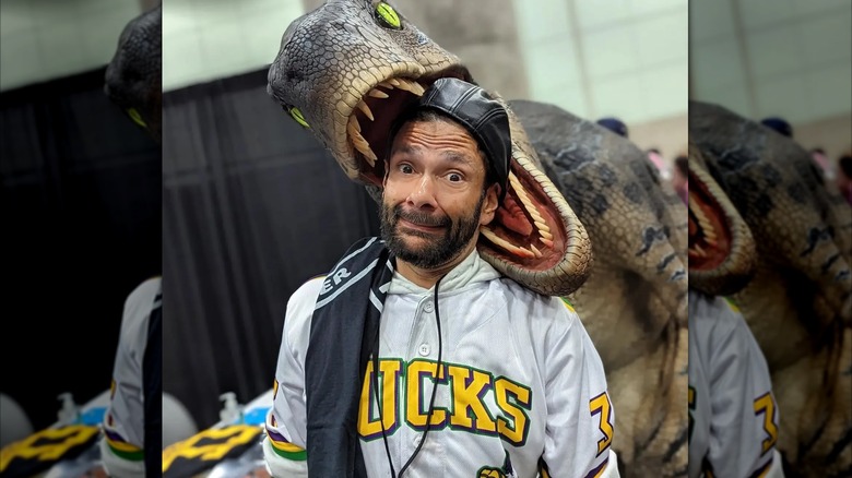 Shaun Weiss posing in a dinosaur's mouth in 2022