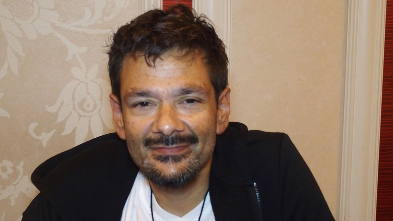 Shaun Weiss wearing a black sports jacket and smiling