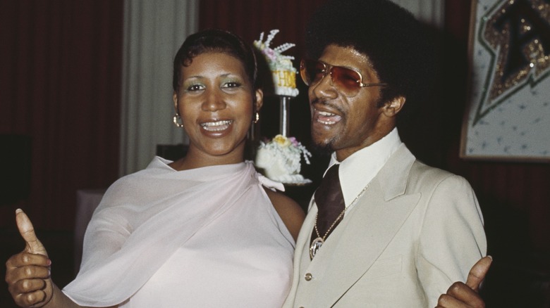 Aretha Franklin and her brother Clarence attend a party