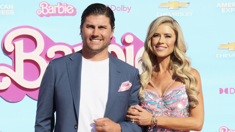 Christina Haack and Josh Hall smiling while posing together at the Barbie premiere