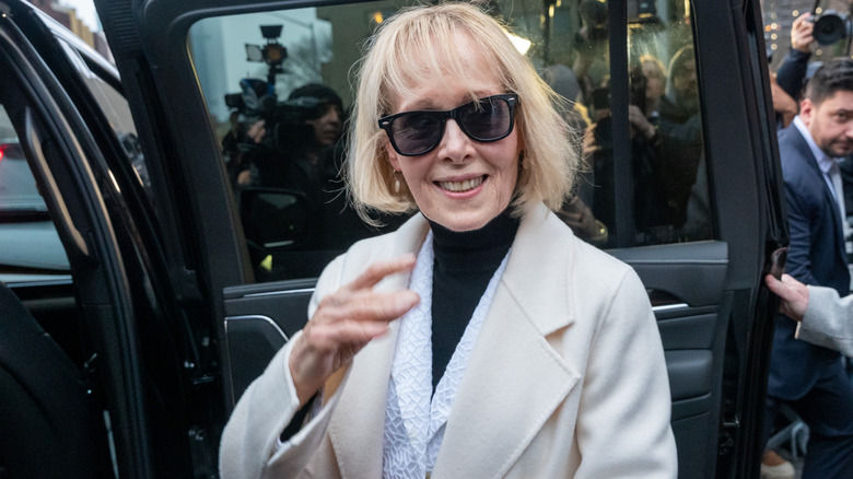 E. Jean Carroll getting into a car while wearing sunglasses