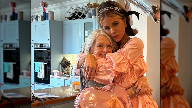 Kate Beckinsale hugs her mother Judy Loe in a photo