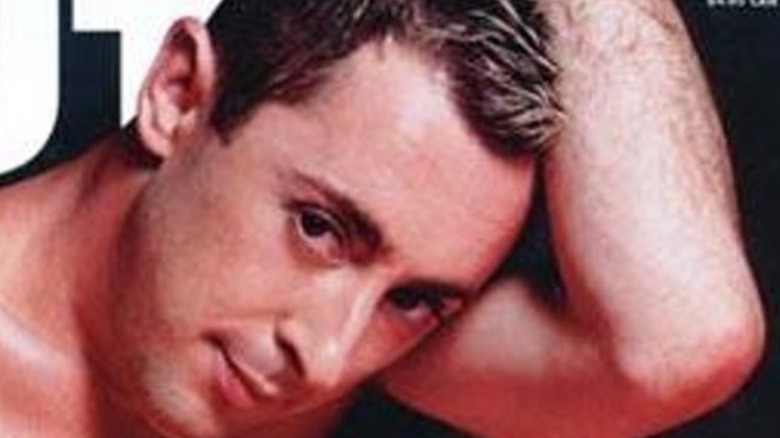 Alan Cumming, posing in the buff on the cover of Out Magazine