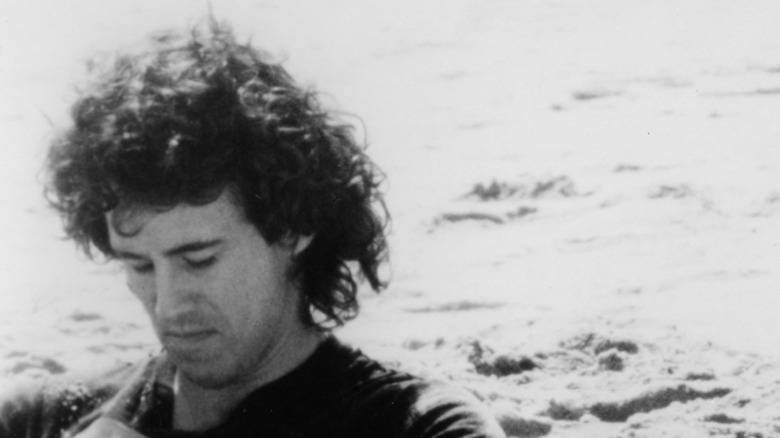 Michael Ontkean looking downwards