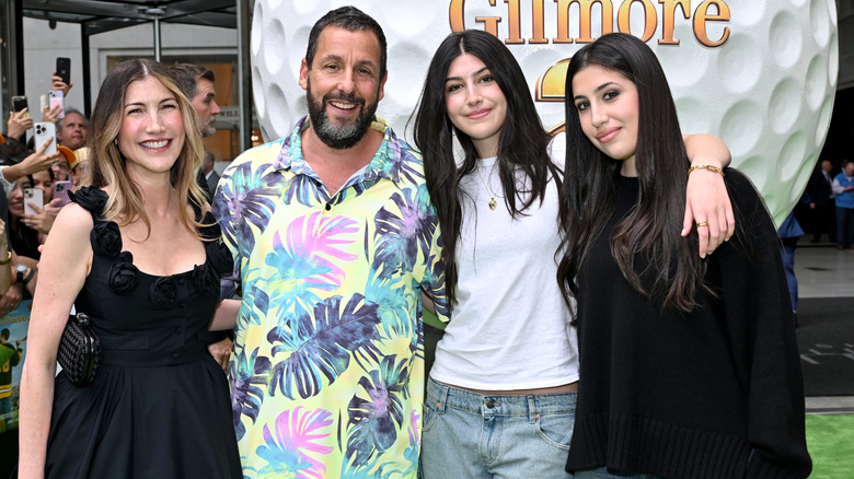 Adam, Jackie, Sadie, and Sunny Sandler smiling at the "Happy Gilmore 2" world premiere in 2025