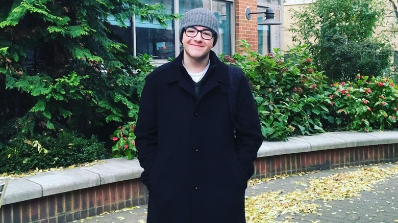 Michael Gandolfini smiling with his hands in his pockets in 2016
