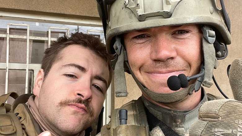 Michael Gandolfini taking a selfie with "Warfare" co-star Will Poulter, both in their Navy SEAL costumes