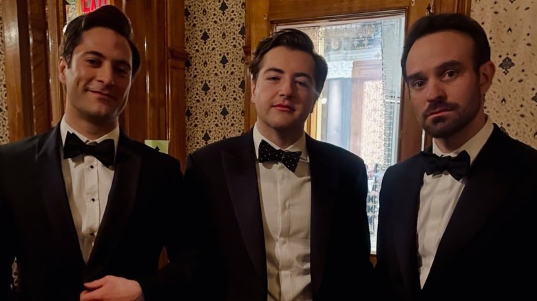 Michael Gandolfini side by side with Arty Froushan and Charlie Cox, all wearing tuxedos