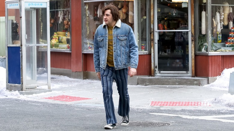 Michael Gandolfini walking on the set of "The Many Saints of Newark," dressed in '60s costume