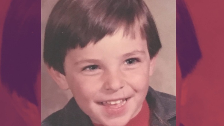 Kavan Smith as a child smiling.