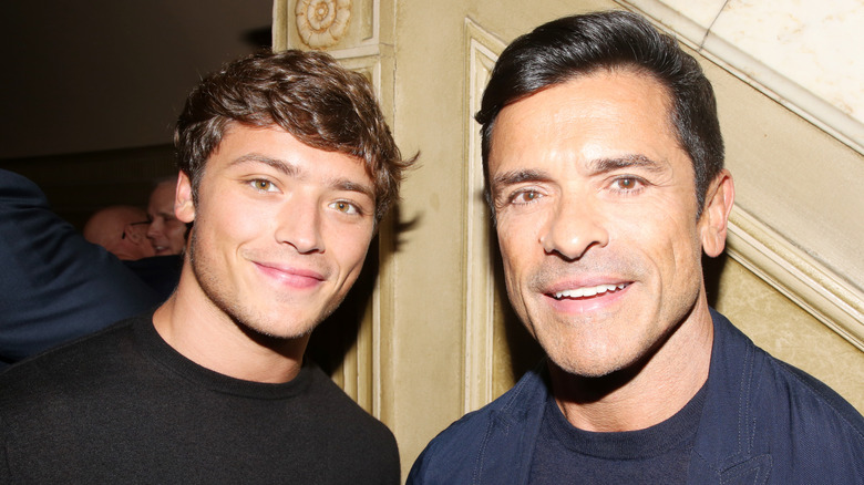 Mark Consuelos and his son Joaquin Consuelos smiling after a Broadway show in a theater