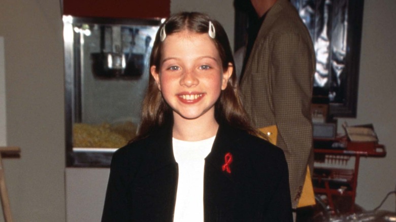 Young Michelle Trachtenberg smiling
