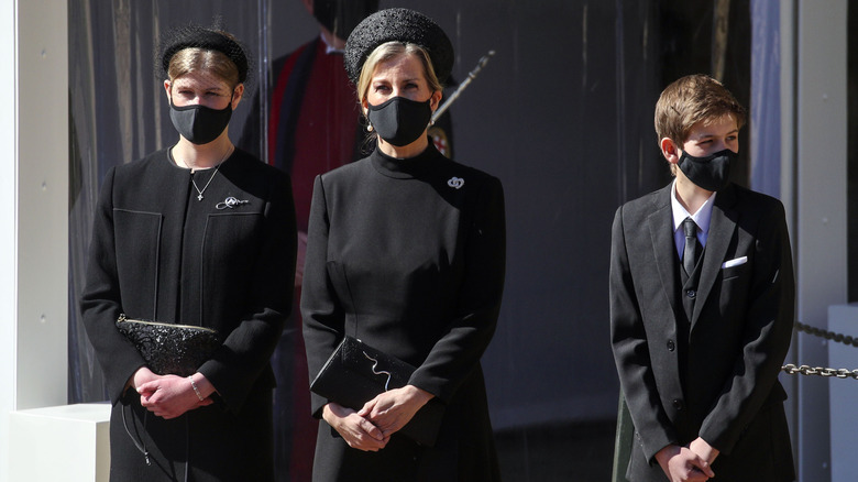 Lady Louise Windsor, Sophie, Countess of Wessex and James, Viscount Severn as they watch the Ceremonial Procession during the funeral of Britain's Prince Philip, Duke of Edinburgh at Windsor Castle on April 17, 2021 in Windsor, England.