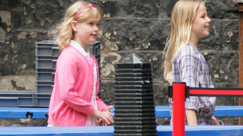Lady Margarita Armstrong-Jones walking behind Lady Louise Windsor