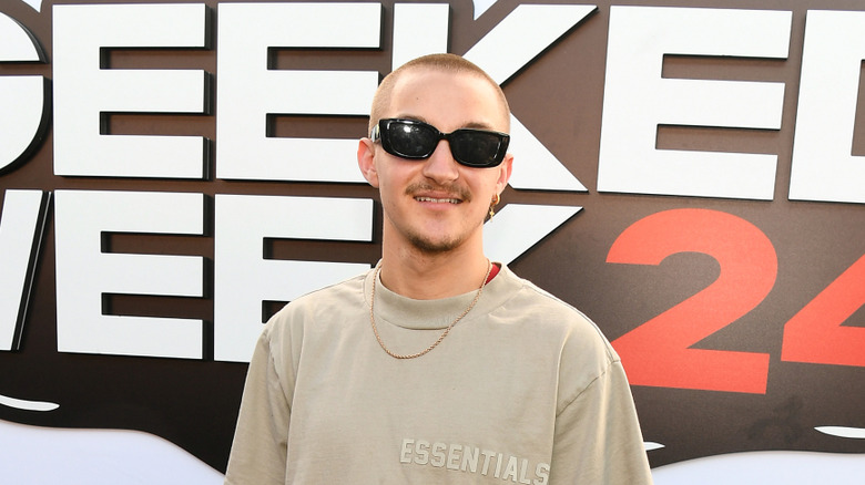 Russell Horning posing on a red carpet in 2024