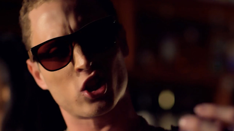 Chet Hanks rapping in a music video