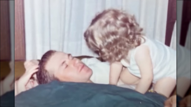 Kristi Noem as a toddler with her father