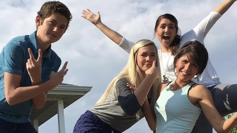 Kristi Noem posing outside with her three teenage children