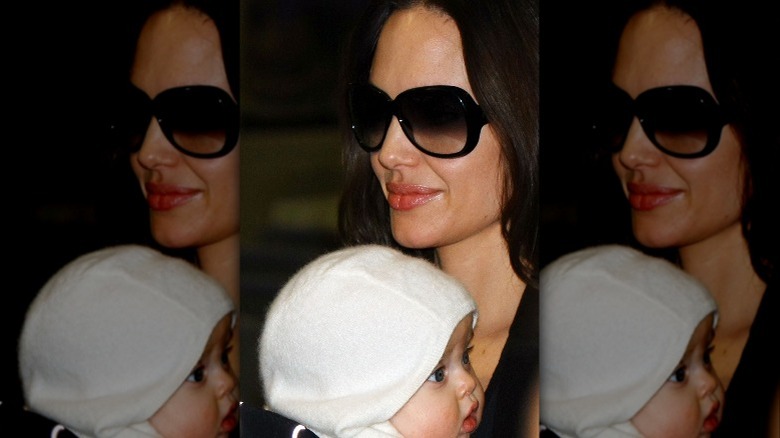 Angelina Jolie holding baby Vivienne
