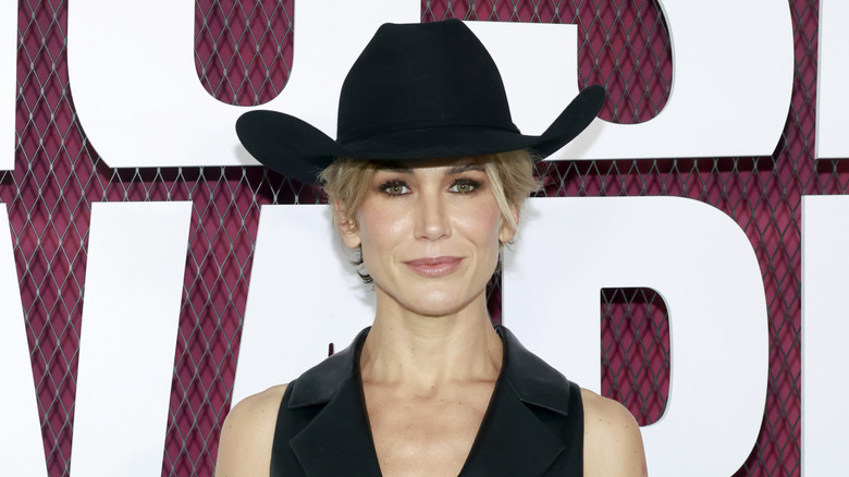 Jennifer Landon posing on step-and-repeat in cowboy hat in 2023
