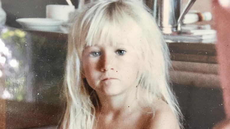 Jennifer Landon as a child looking at the camera