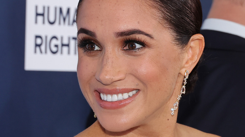 Meghan Markle smiling at an event