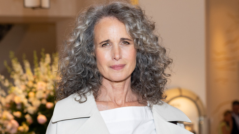 Andie MacDowell smiling slightly