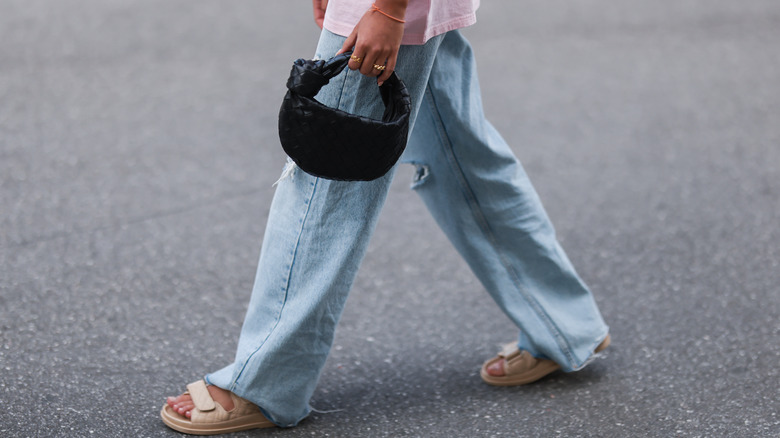 person in wide leg pants