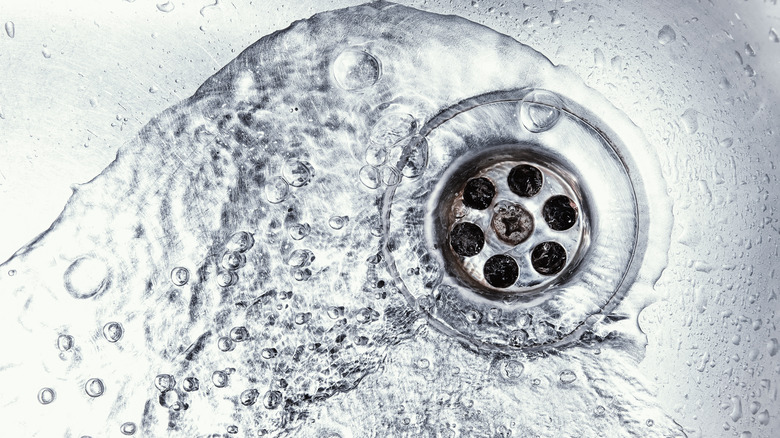 Water running down a drain 