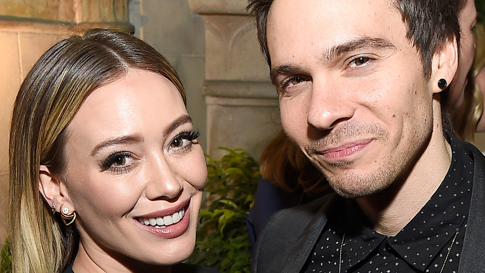 Hilary Duff and Matthew Koma smiling at event